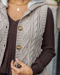 Hooded cable knit vest in oatmeal